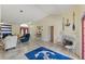 Inviting living room with nautical decor, tile floors, and vaulted ceilings, perfect for seaside charm at 5188 Elwood Rd, Spring Hill, FL 34608