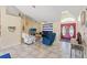 Bright living room with vaulted ceilings, tile floors, and a decorative nautical theme throughout at 5188 Elwood Rd, Spring Hill, FL 34608