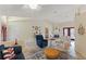 Spacious living area with vaulted ceilings, tile floors, and decorative elements leading to other spaces at 5188 Elwood Rd, Spring Hill, FL 34608