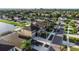 Aerial view of a two-story home with lush lawn and landscaping, with a two car garage and extended driveway at 1739 Broad Winged Hawk Dr, Ruskin, FL 33570