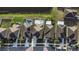 Top-down aerial view of neighborhood homes, showing rooflines and pond at 1739 Broad Winged Hawk Dr, Ruskin, FL 33570