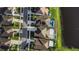 Aerial view of neighborhood homes, showing rooflines and pond at 1739 Broad Winged Hawk Dr, Ruskin, FL 33570