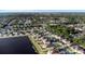Aerial shot of house next to the lake that has a swimming pool in a well-maintained neighborhood at 1739 Broad Winged Hawk Dr, Ruskin, FL 33570