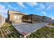 The backyard features a large patio, screened-in lanai, and plenty of green space at 1739 Broad Winged Hawk Dr, Ruskin, FL 33570