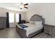 Comfortable bedroom with a large bed, nightstands, and wood flooring at 1739 Broad Winged Hawk Dr, Ruskin, FL 33570