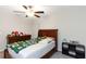 Comfortable bedroom featuring wood furniture, ceiling fan, and ample space to create a personalized retreat at 1739 Broad Winged Hawk Dr, Ruskin, FL 33570