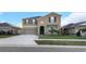 Charming home features a neat lawn, an attached two-car garage, and a welcoming entrance at 1739 Broad Winged Hawk Dr, Ruskin, FL 33570