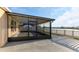 Spacious lanai and patio area with serene views of the lake at 1739 Broad Winged Hawk Dr, Ruskin, FL 33570