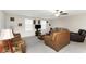 A cozy living room with a ceiling fan and plenty of seating at 1739 Broad Winged Hawk Dr, Ruskin, FL 33570