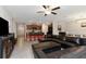 Open-concept living room flows into the kitchen and dining area, perfect for entertaining at 1739 Broad Winged Hawk Dr, Ruskin, FL 33570
