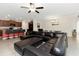 Open-concept living space with a comfortable sectional sofa and kitchen with counter seating at 1739 Broad Winged Hawk Dr, Ruskin, FL 33570