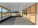 Covered patio area with screens provides an ideal space for relaxation at 1739 Broad Winged Hawk Dr, Ruskin, FL 33570