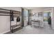Cozy bedroom featuring a desk, carpet flooring, and large window with pleasant outdoor views at 30835 Wild Juniper Ct, Brooksville, FL 34602
