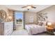 Cozy bedroom with neutral tones, decorative wall art, and soft, natural light at 30863 Wild Juniper Ct, Brooksville, FL 34602