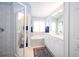 Bright bathroom features vanity, walk-in shower, and bathtub with coordinated tile at 3389 Pennyroyal Rd, Port Charlotte, FL 33953
