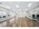 Spacious fitness room with hardwood flooring, mirrored wall, and plenty of natural light at 3389 Pennyroyal Rd, Port Charlotte, FL 33953