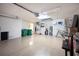 Spacious two-car garage with epoxy floor, overhead lighting and storage at 3389 Pennyroyal Rd, Port Charlotte, FL 33953