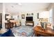 Comfortable living room features warm lighting, shutters, neutral seating and decor at 3389 Pennyroyal Rd, Port Charlotte, FL 33953