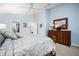 Spacious main bedroom features coordinated lamps, dresser, mirror and walk-in closet at 3389 Pennyroyal Rd, Port Charlotte, FL 33953