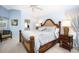 Comfortable main bedroom with neutral walls, carpet and coordinated lamps and furniture at 3389 Pennyroyal Rd, Port Charlotte, FL 33953