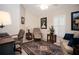 Home office with comfortable seating, a desk, and natural light from a shuttered window at 3389 Pennyroyal Rd, Port Charlotte, FL 33953