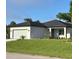 Charming single-story home with a well-kept lawn and tidy landscaping at 2370 Allsup Ter, North Port, FL 34286