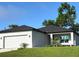 Beautiful single-story home with a two-car garage and attractive landscaping at 2370 Allsup Ter, North Port, FL 34286