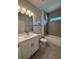 Contemporary bathroom with a sleek vanity, modern fixtures, and a tiled shower at 4097 Feather Ter, North Port, FL 34286