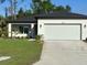 Charming single-story home with a well-manicured lawn and a spacious two-car garage at 4097 Feather Ter, North Port, FL 34286