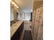 The bathroom boasts double sinks, a soaking tub, a shower with a nautical themed curtain at 8343 Fantasia Park Way, Riverview, FL 33578
