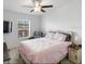 Bright bedroom with a cozy chair and a ceiling fan, perfect for relaxing and unwinding after a long day at 8343 Fantasia Park Way, Riverview, FL 33578
