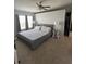 Spacious bedroom with neutral tones, a large bed, and a ceiling fan, perfect for relaxation and rest at 8343 Fantasia Park Way, Riverview, FL 33578