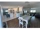 Open-concept kitchen with a large island and bar seating adjacent to the living room at 8343 Fantasia Park Way, Riverview, FL 33578