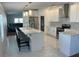 Bright kitchen with stainless steel appliances and a marble-top island with seating at 8343 Fantasia Park Way, Riverview, FL 33578