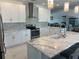 Contemporary kitchen featuring stainless steel appliances, white cabinets, and a stylish backsplash at 8343 Fantasia Park Way, Riverview, FL 33578