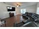 Spacious living room with hardwood floors, large sectional couch and lots of natural light at 8343 Fantasia Park Way, Riverview, FL 33578
