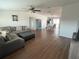 Comfortable living room flowing into the dining area, featuring a plush sectional sofa at 8343 Fantasia Park Way, Riverview, FL 33578