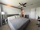 Large main bedroom with neutral tones, ceiling fan, and bathroom entrance, perfect for relaxation and rest at 8343 Fantasia Park Way, Riverview, FL 33578