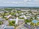 An aerial view of a sprawling community with manicured lawns and a nearby marina, set against a scenic skyline at 2401 Ecuadorian Way # 45, Clearwater, FL 33763
