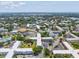 An aerial shot highlights a well-maintained community with interconnected buildings, green spaces, and recreational facilities at 2401 Ecuadorian Way # 45, Clearwater, FL 33763
