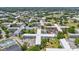 A high-angle view showcases lush landscaping surrounding multiple low-rise buildings with ample parking in a vibrant community at 2401 Ecuadorian Way # 45, Clearwater, FL 33763