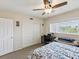 Bedroom featuring a window for natural light, closet with doors, and a ceiling fan for comfort at 2401 Ecuadorian Way # 45, Clearwater, FL 33763