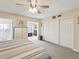 Well-lit bedroom featuring carpet, double closets, and seamless access to a connected room at 2401 Ecuadorian Way # 45, Clearwater, FL 33763