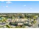 Aerial view of a multi-story building, showcasing its layout, parking facilities, and surrounding greenery at 2401 Ecuadorian Way # 45, Clearwater, FL 33763