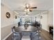 Elegant dining room with a large table and mirrored wall creating a spacious feel at 2401 Ecuadorian Way # 45, Clearwater, FL 33763