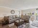 Comfortable living room with wood floors, neutral paint, and plenty of natural light at 2401 Ecuadorian Way # 45, Clearwater, FL 33763