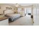 Comfortable bedroom with neutral tones, carpet, and an abundance of natural light at 2401 Ecuadorian Way # 45, Clearwater, FL 33763