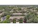 An elevated view of townhomes nestled amongst mature trees and landscaping in a planned community at 4510 Limerick Dr, Tampa, FL 33610
