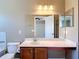 Bathroom with a vanity, mirror, and an open doorway leading to another room at 4510 Limerick Dr, Tampa, FL 33610