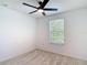 Bedroom featuring carpet, a ceiling fan, and natural light from the window at 4510 Limerick Dr, Tampa, FL 33610